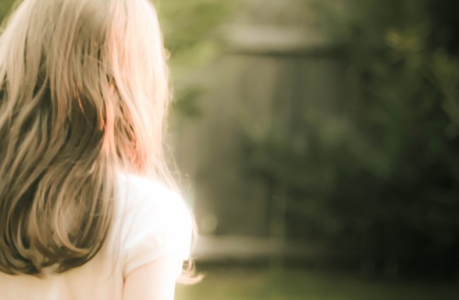 blurry picture of a woman with long hair